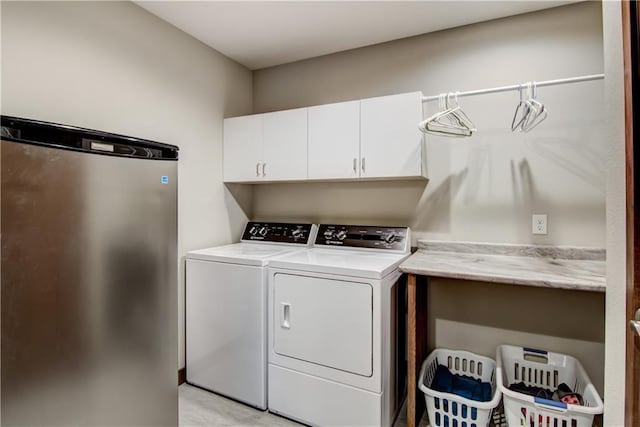4708 Abbey Rd, Eau Claire, WI 54701 - laundry area with cabinet space and washer and clothes dryer