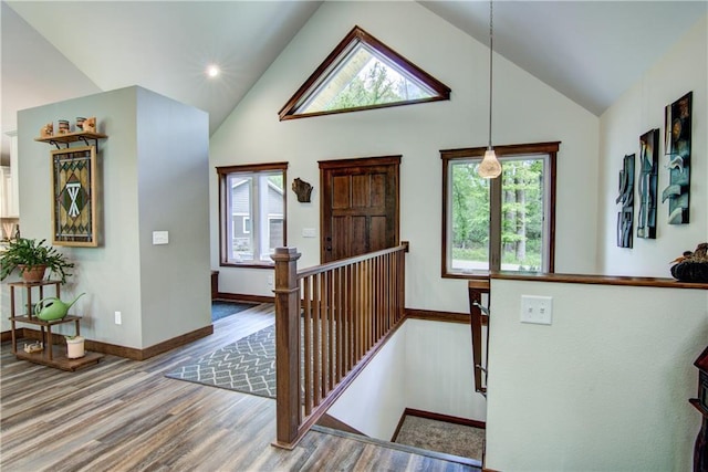 4708 Abbey Rd, Eau Claire, WI 54701 - foyer entrance with healthy amount of natural light, wood finished floors, baseboards, and high vaulted ceiling