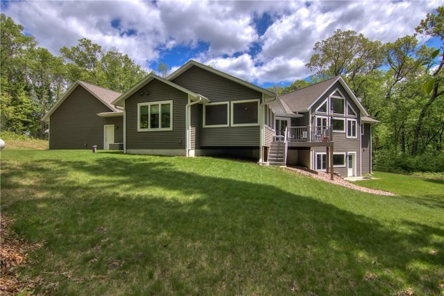 4708 Abbey Rd, Eau Claire, WI 54701 - back of house featuring a deck, a lawn, and stairs