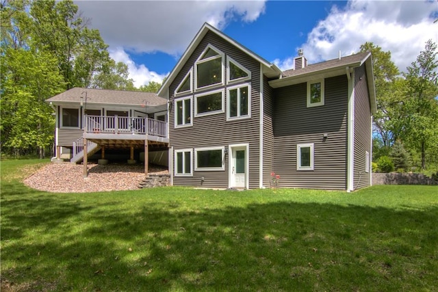 4708 Abbey Rd, Eau Claire, WI 54701 - back of house featuring a wooden deck, a chimney, a yard, and stairway