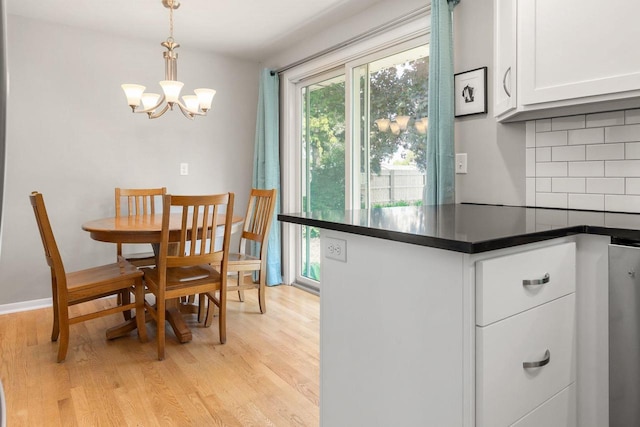 208 Edgewood Dr, Neenah, WI 54956 - dining room featuring light wood-type flooring and a chandelier