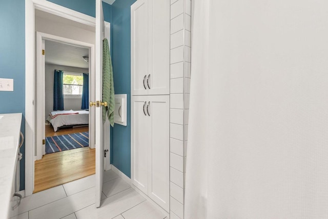 208 Edgewood Dr, Neenah, WI 54956 - bathroom with connected bathroom, tile patterned flooring, a shower with shower curtain, and baseboards