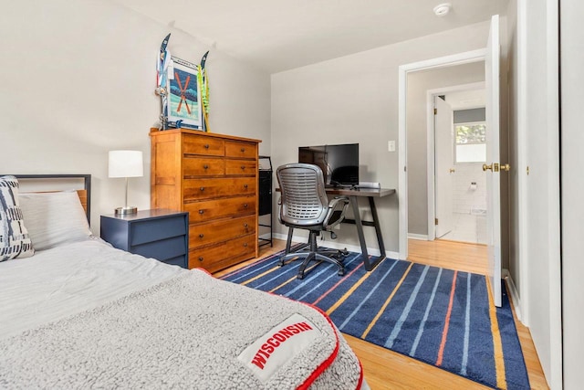 208 Edgewood Dr, Neenah, WI 54956 - bedroom with wood finished floors, an office area, and baseboards