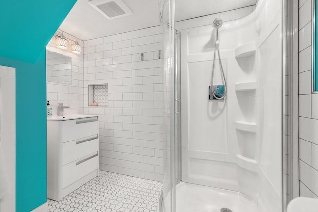 208 Edgewood Dr, Neenah, WI 54956 - bathroom with tile walls, a stall shower, vanity, and tile patterned floors