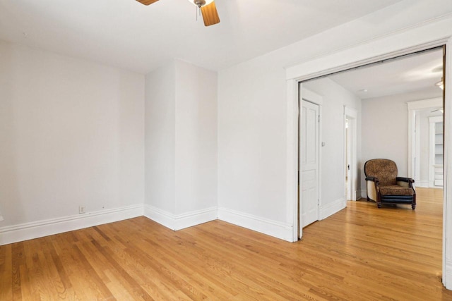 310 E Smith St Unit 312, Milwaukee, WI 53207 - spare room featuring a ceiling fan, light wood finished floors, and baseboards