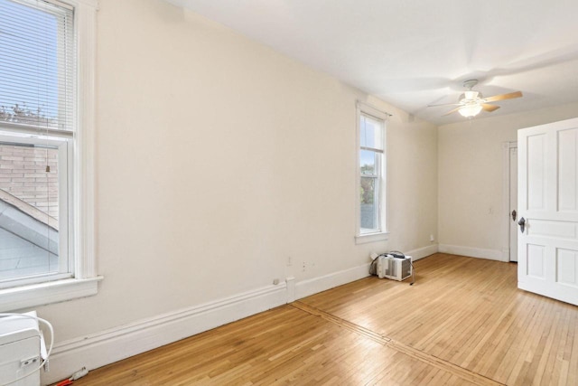 310 E Smith St Unit 312, Milwaukee, WI 53207 - spare room featuring light wood-type flooring, baseboards, and ceiling fan