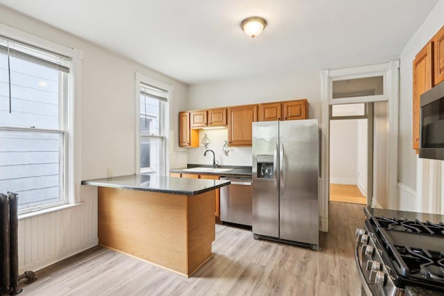310 E Smith St Unit 312, Milwaukee, WI 53207 - kitchen featuring stainless steel appliances, light wood-style floors, a sink, and plenty of natural light