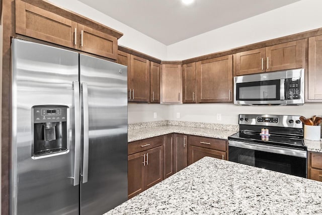 4857 Suelo Rd, Fitchburg, WI 53711 - kitchen featuring appliances with stainless steel finishes and light stone counters