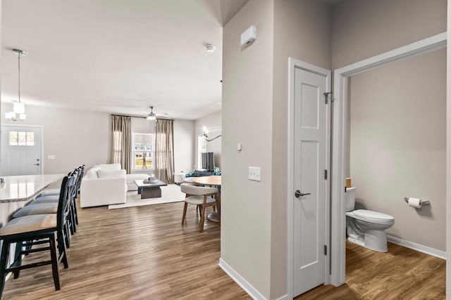 4857 Suelo Rd, Fitchburg, WI 53711 - corridor featuring wood finished floors and baseboards