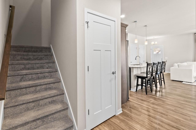 4857 Suelo Rd, Fitchburg, WI 53711 - stairway featuring wood finished floors and baseboards