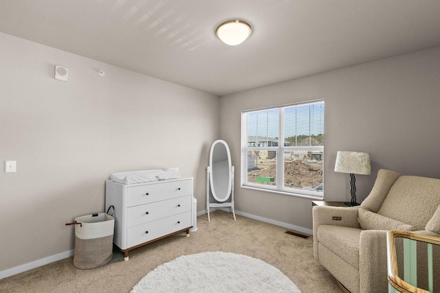 4857 Suelo Rd, Fitchburg, WI 53711 - living area featuring light carpet and baseboards