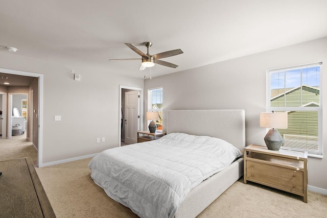 4857 Suelo Rd, Fitchburg, WI 53711 - carpeted bedroom featuring multiple windows, baseboards, and ceiling fan