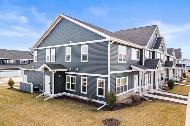 4857 Suelo Rd, Fitchburg, WI 53711 - view of side of property featuring a lawn and roof with shingles