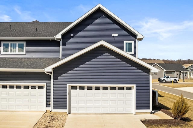 4857 Suelo Rd, Fitchburg, WI 53711 - view of front facade featuring concrete driveway and a shingled roof