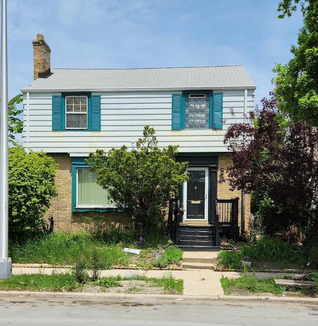 3914 W Hampton Ave, Milwaukee, WI 53209 - colonial-style house with a chimney and brick siding