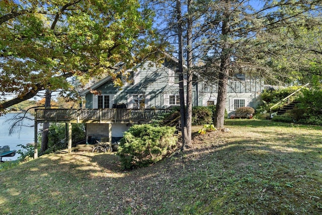 N53W34956 Rd B, Okauchee, WI 53069 - view of side of property featuring a deck and a lawn