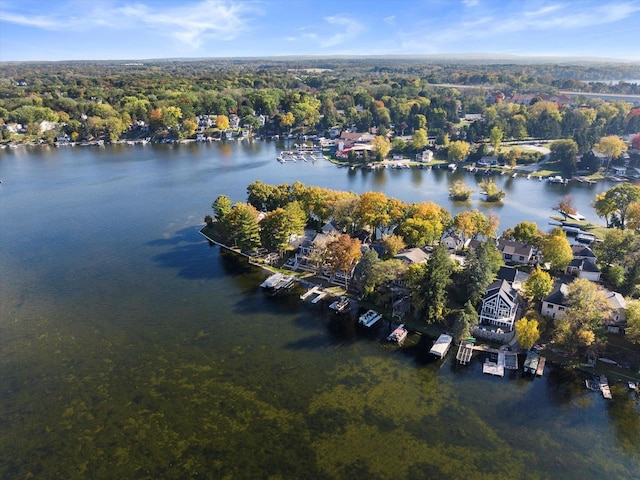 N53W34956 Rd B, Okauchee, WI 53069 - aerial overview of property's location featuring a nearby body of water and a heavily wooded area