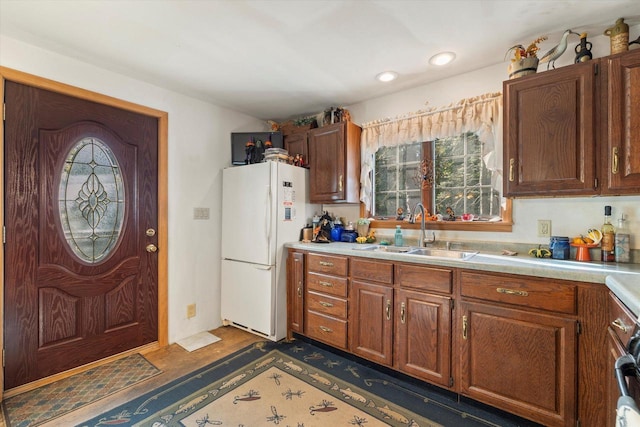 N53W34956 Rd B, Okauchee, WI 53069 - kitchen featuring a sink, freestanding refrigerator, light countertops, plenty of natural light, and recessed lighting