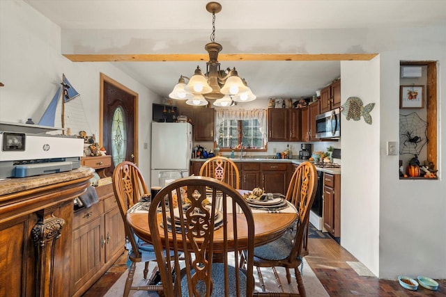 N53W34956 Rd B, Okauchee, WI 53069 - dining area featuring a chandelier, beamed ceiling, and dark wood finished floors