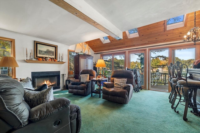 N53W34956 Rd B, Okauchee, WI 53069 - living area featuring a skylight, carpet, a warm lit fireplace, and healthy amount of natural light