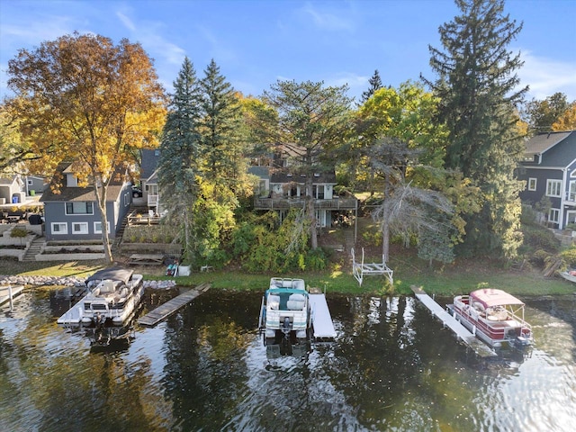 N53W34956 Rd B, Okauchee, WI 53069 - dock area featuring a water view, boat lift, and a residential view