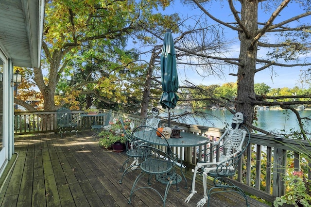 N53W34956 Rd B, Okauchee, WI 53069 - wooden deck with a water view and outdoor dining area