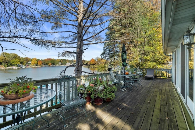 N53W34956 Rd B, Okauchee, WI 53069 - deck featuring outdoor dining area and a water view