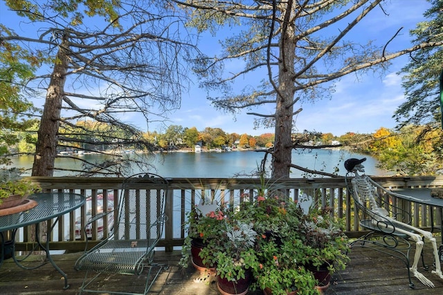 N53W34956 Rd B, Okauchee, WI 53069 - wooden terrace with a water view