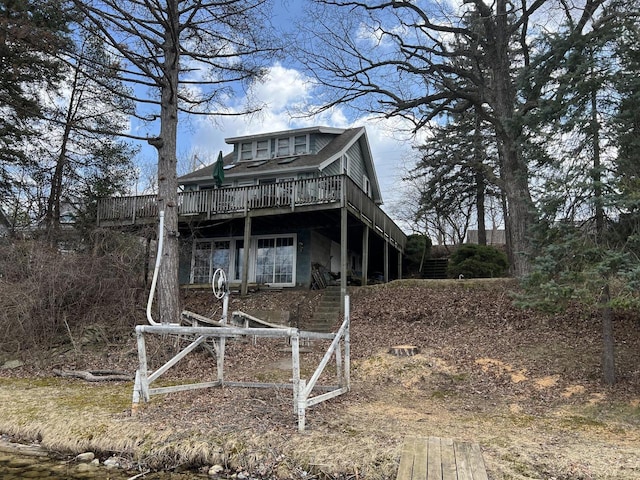 N53W34956 Rd B, Okauchee, WI 53069 - view of front facade featuring a wooden deck