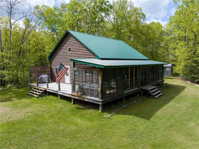 82912 Augustine Rd, Glidden, WI 54527 - rear view of property with a sunroom, a yard, and a deck