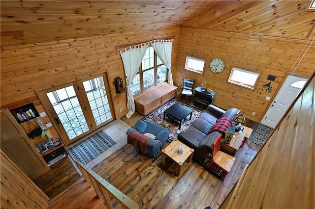 82912 Augustine Rd, Glidden, WI 54527 - living room with wood walls, hardwood / wood-style floors, plenty of natural light, and lofted ceiling