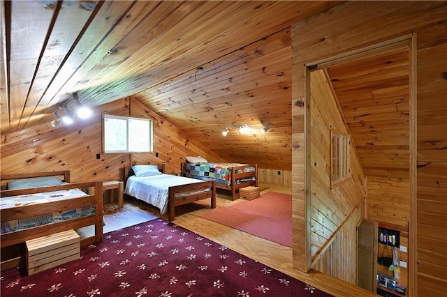 82912 Augustine Rd, Glidden, WI 54527 - bedroom featuring wood walls, vaulted ceiling, and wood finished floors