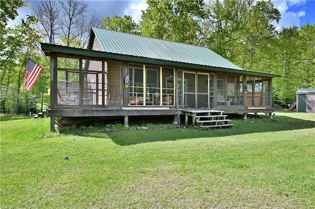 82912 Augustine Rd, Glidden, WI 54527 - rear view of property with a sunroom, a yard, and metal roof