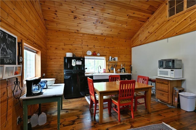 82912 Augustine Rd, Glidden, WI 54527 - dining area with wooden walls, plenty of natural light, hardwood / wood-style flooring, and high vaulted ceiling