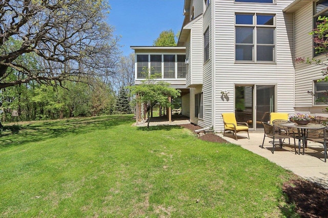 10 Prairie Hill Ct, Madison, WI 53719 - back of house featuring a patio, a lawn, and a sunroom