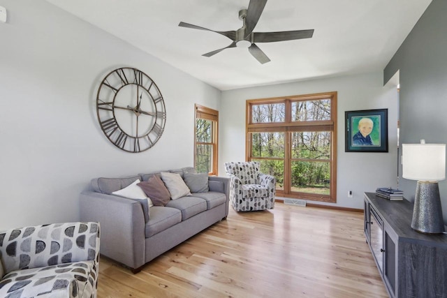 10 Prairie Hill Ct, Madison, WI 53719 - living room with ceiling fan, light wood finished floors, and baseboards