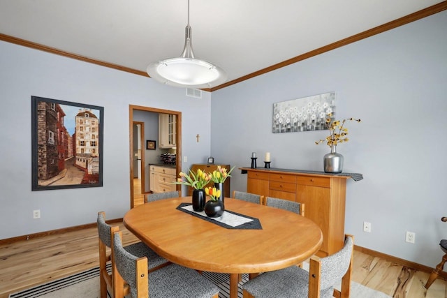 10 Prairie Hill Ct, Madison, WI 53719 - dining room with crown molding, light wood-type flooring, and baseboards
