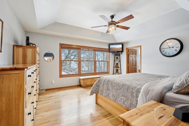 10 Prairie Hill Ct, Madison, WI 53719 - bedroom featuring a raised ceiling, light wood-type flooring, baseboards, and a ceiling fan