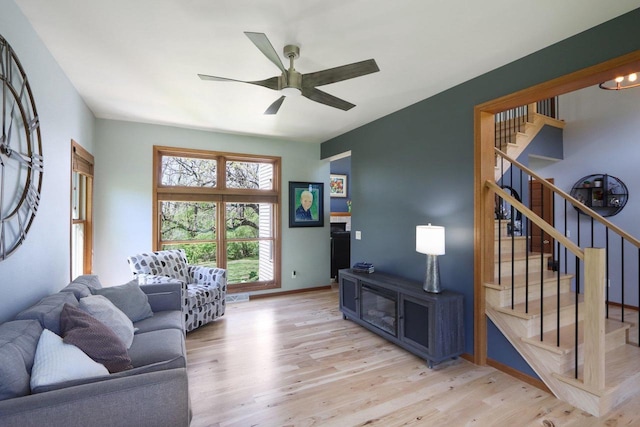 10 Prairie Hill Ct, Madison, WI 53719 - living room with wood finished floors, stairway, a ceiling fan, and baseboards