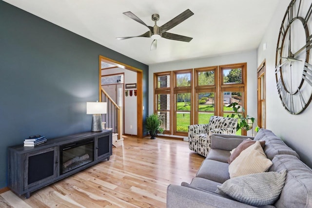 10 Prairie Hill Ct, Madison, WI 53719 - living room with a ceiling fan, light wood-style floors, and stairs