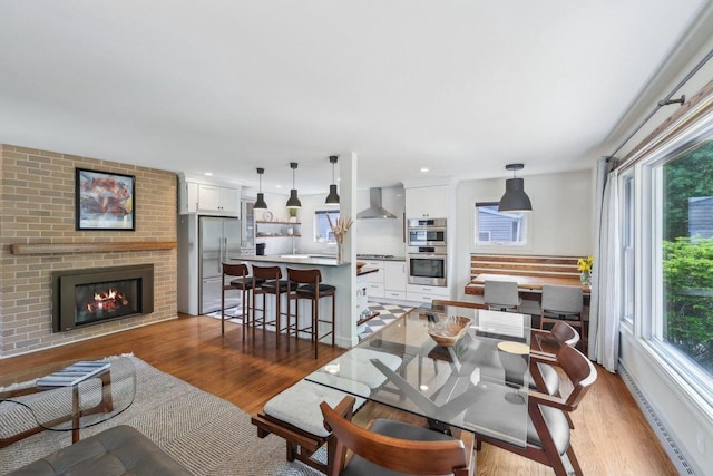 3910 Birch Ave, Madison, WI 53711 - dining area featuring wood finished floors and a fireplace