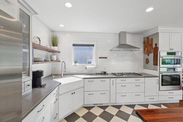 3910 Birch Ave, Madison, WI 53711 - kitchen with stainless steel appliances, wall chimney exhaust hood, a sink, backsplash, and recessed lighting