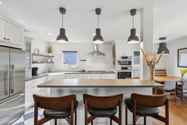 3910 Birch Ave, Madison, WI 53711 - kitchen featuring appliances with stainless steel finishes, a sink, wall chimney range hood, backsplash, and recessed lighting