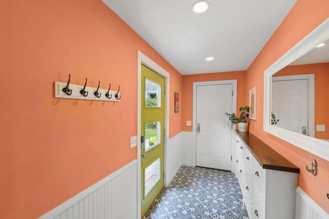 3910 Birch Ave, Madison, WI 53711 - doorway to outside with a wainscoted wall and recessed lighting