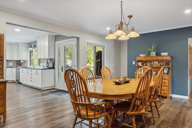 N3504 State Rd 80, Elroy, WI 53929 - dining area featuring dark wood-type flooring, ornamental molding, recessed lighting, a chandelier, and baseboards