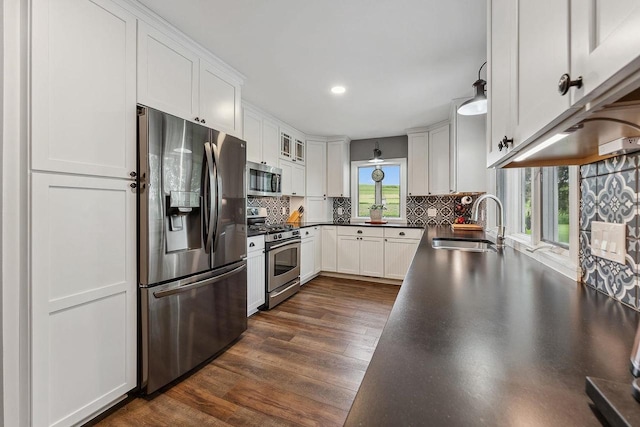 N3504 State Rd 80, Elroy, WI 53929 - kitchen with stainless steel appliances, a sink, dark countertops, white cabinetry, and recessed lighting