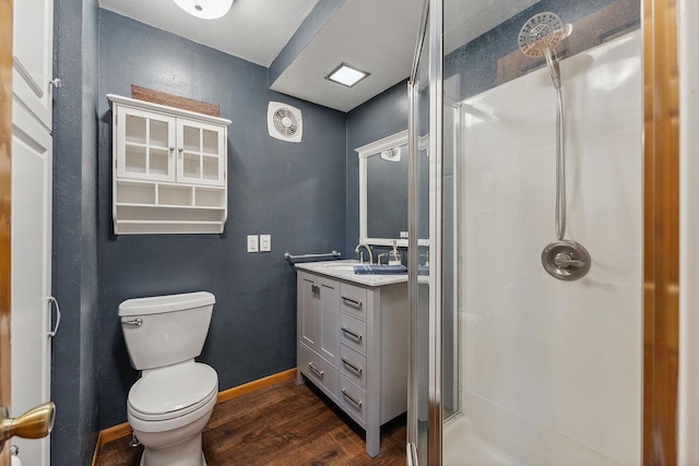 N3504 State Rd 80, Elroy, WI 53929 - bathroom featuring a shower stall, wood finished floors, vanity, toilet, and baseboards