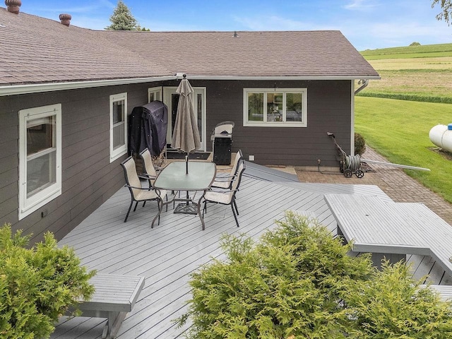 N3504 State Rd 80, Elroy, WI 53929 - wooden deck featuring outdoor dining space and a yard