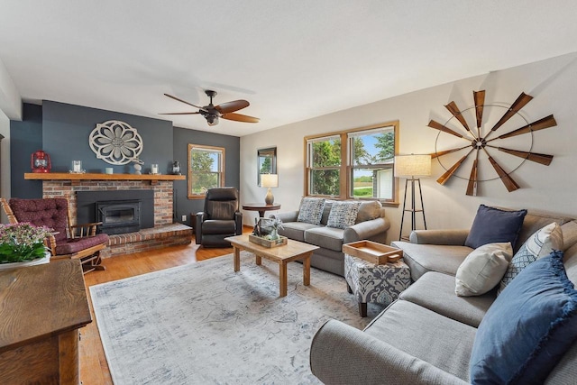 N3504 State Rd 80, Elroy, WI 53929 - living room featuring healthy amount of natural light, wood finished floors, a fireplace, and ceiling fan