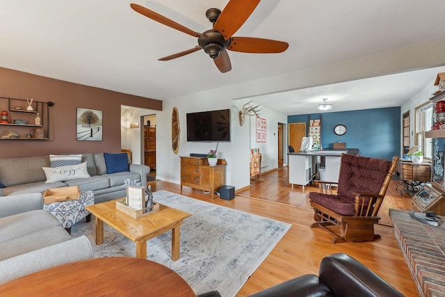 N3504 State Rd 80, Elroy, WI 53929 - living area with a ceiling fan and light wood-style flooring